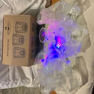 Fun set of 10 2” plastic lite up shot glasses.  Great for toasts or parties.